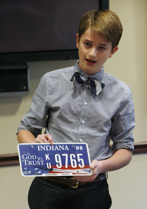 Francisco Kjolseth  |  The Salt Lake Tribune
Tate Christensen, 11, who collects license plates, shows off the Indiana license plate he owns that made him wonder why Utah didn't have one featuring the words 