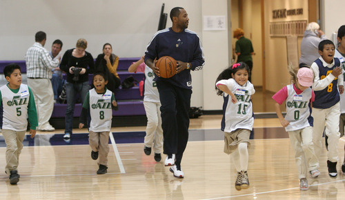 Steve Griffin | The Salt Lake Tribune

Mo Williams of the Utah Jazz runs kids from the U.S. Dream Academy through warmup drills during a private basketball clinic. About 55 children ages 8 to 14 attended the event at the Zions Bank Basketball Center in Salt Lake City on Wednesday, Oct. 24, 2012.