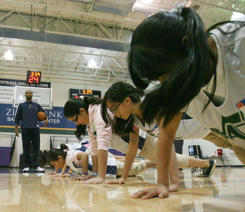 Steve Griffin | The Salt Lake Tribune


Students from the U.S. Dream Academy do pushups after loosing a dribbling race as Mo Williams, of the Utah Jazz, tells them they are getting stronger during in a private basketball clinic for local at-risk youth. About 55 children, between the ages of 8-14 years old, attend the event at the Zions Bank Basketball Center in Salt Lake City, Utah Wednesday October 24, 2012. Derrick Favors along with Jazz coaches Brad Jones, Johnnie Bryant, Richard Smith and Mark McKown along with WIlliams taught the kids fundamental basketball skills during the one hour event. The U.S. Dream Academy is a nonprofit organization that focuses on assisting children who have a parent or other family member that is incarcerated. The Utah chapter is based at the Dual Immersion Academy in Salt Lake City where it provides after-school programs that help vulnerable youth develop the skills needed to lead successful lives.