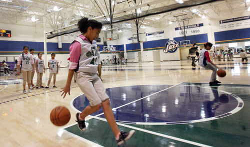 Steve Griffin | The Salt Lake Tribune


Students from the U.S. Dream Academy run through dribbling drills during a private basketball clinic for local at-risk youth. About 55 children, between the ages of 8-14 years old, attend the event at the Zions Bank Basketball Center in Salt Lake City, Utah Wednesday October 24, 2012. Mo Williams, Derick Favors ane Jazz coaches Brad Jones, Johnnie Bryant, Richard Smith and Mark McKown taught the kids fundamental basketball skills during the one hour event. The U.S. Dream Academy is a nonprofit organization that focuses on assisting children who have a parent or other family member that is incarcerated. The Utah chapter is based at the Dual Immersion Academy in Salt Lake City where it provides after-school programs that help vulnerable youth develop the skills needed to lead successful lives.