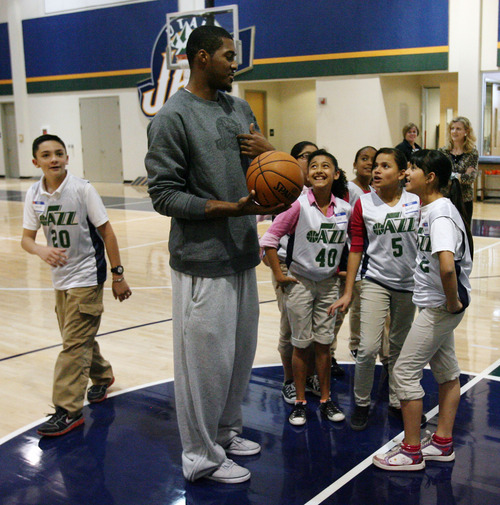 Steve Griffin | The Salt Lake Tribune

Derrick Favors works with children from the U.S. Dream Academy during a private basketball clinic for at-risk youth. About 55 children ages 8 to 14 attended the event at the Zions Bank Basketball Center in Salt Lake City on Wednesday, Oct. 24, 2012.