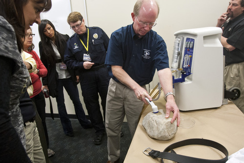 Chris Detrick  |  The Salt Lake Tribune
Microbial-Vac Systems VP of Engineering and Operations Wayne Carlsen demonstrates how to use the M-Vac System at the West Jordan Police Department Wednesday October 24, 2012. ]