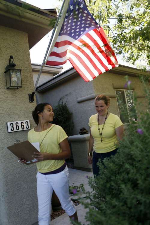 Utah republicans Juleen Jackson, right, and her daughter Mary Alice Jackson canvas homes on Saturday, Oct. 20, 2012 in Las Vegas. (Isaac Brekken for the Salt Lake Tribune)