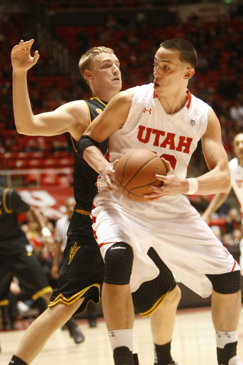 Chris Detrick  |  The Salt Lake Tribune
Utah Utes center Jason Washburn (42) is guarded by Arizona State Sun Devils forward Jonathan Gilling (31) during the first half of the game at the Huntsman Center Saturday January 21, 2012. Utah is winning the game 38-21.