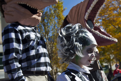 Chris Detrick  |  The Salt Lake Tribune
The Peterson family, Bret, Stephanie, Gage, 6, and Bailey, 9, dressed as characters from Beetlejuice during the Monster Block Party at the Gallivan Center Saturday October 27, 2012. They won second place in the costume contest.