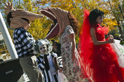 Chris Detrick  |  The Salt Lake Tribune
The Peterson family, Bret, Stephanie, Gage, 6, and Bailey, 9, dressed as characters from Beetlejuice during the Monster Block Party at the Gallivan Center Saturday October 27, 2012. They won second place in the costume contest.