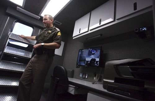 Leah Hogsten  |  The Salt Lake Tribune
Utah Highway Patrol alcohol technician Shawn Thomas describes the features of the Patrol's DUI center's vehicle able to process two intoxicated drivers at a time. Utah Highway Patrol unveiled a new mobile command center used for DUI enforcement, Saturday, October 26, 2012.