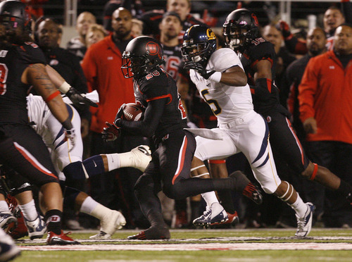 Scott Sommerdorf  |  The Salt Lake Tribune              
Utah Utes defensive back Ryan Lacy (26) runs with an interception late in the second quarter. The play help set up Utah's final TD of the half. Utah led Cal 28-6 at the half, Saturday, October 27, 2012.