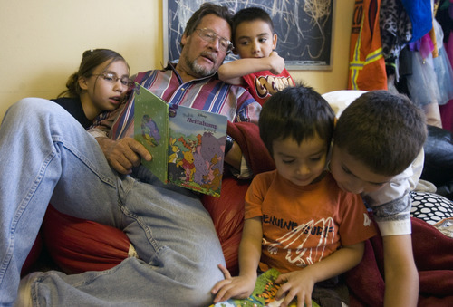 Kim Raff | The Salt Lake Tribune
Rich Larson hangs out with his kids during reading time in their home in Layton, Utah, on October 24, 2012. Richard and his wife Happie adopted 15 children from foster care. She was able to get a tax credit that eased adoption expenses for four of the children. That tax credit will expire at the end of the year.