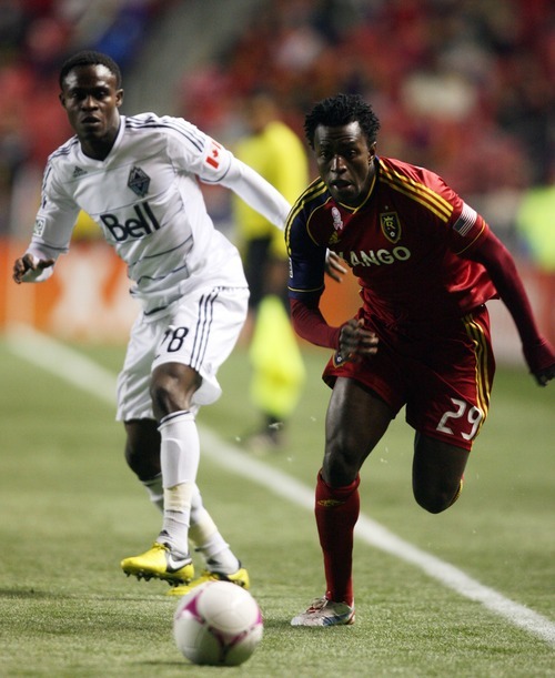 Kim Raff | The Salt Lake Tribune
(right) Real Salt Lake midfielder Kenny Mansally (29) tries to maintain possession as Vancouver FC midfielder Gershon Koffie (28) defends during a game at Rio Tinto Stadium in Sandy, Utah on October 27, 2012.