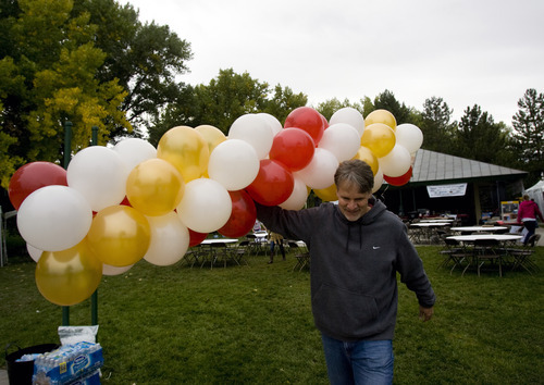 Kim Raff | The Salt Lake Tribune
Steve Nielsen, owner of Balloon Bonanza, carries a column of air-filled balloons he now uses more because of the national shortage of helium, before the Leukemia and Lymphoma Society's Light the Night Walk at Sugarhouse Park in Salt Lake City, Utah on October 13, 2012.