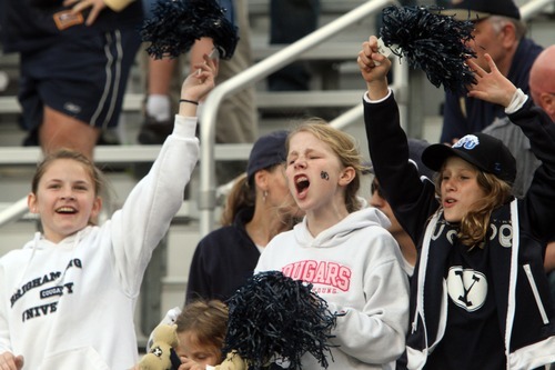 Rick Egan  | The Salt Lake Tribune 

Twelve-year-old BYU fans Autumn Dustin (left) Chandler Hatch (center) and Lauren Hatch,  from Canton, Georgia, cheer for the Cougars, as BYU faced Georgia Tech, at Bobby Dodd Stadium in Atlanta, Saturday, October 27, 2012