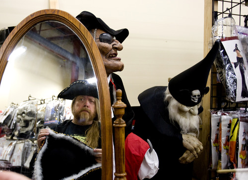 Kim Raff | The Salt Lake Tribune
Chris Hanson tries on a pirate hat at Mask Costumes in Taylorsville on Oct. 25, 2012.