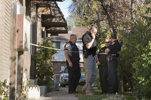 Paul Fraughton | Salt Lake Tribune
Police officers investigate the scene of a shooting at an apartment on the 2300 block of Green Street in Sugar House.
 Tuesday, October 30, 2012