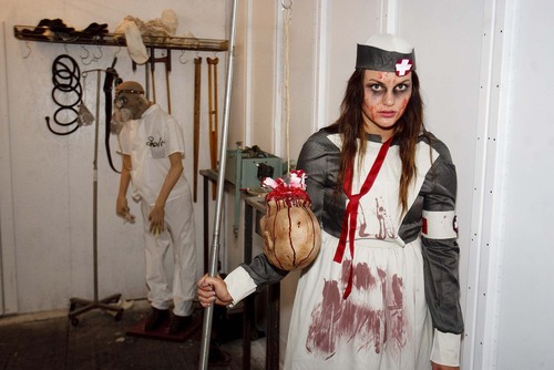 Trent Nelson  |  The Salt Lake Tribune
A bloody nurse stalks the operating room at the Strangling Brothers Haunted Circus in Draper in 2011.