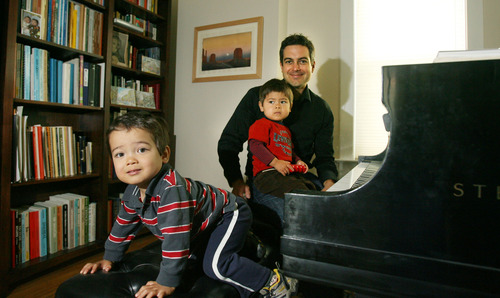 Steve Griffin | The Salt Lake Tribune
Jason Hardink, Utah Symphony principal keyboardist and director of the NOVA Chamber Music Series, sits at his piano with his twin sons, Derek (front) and Luc, in his Salt Lake City home in October 2012.