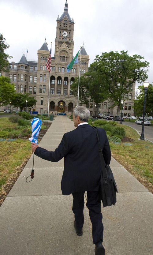 Tribune file photo
Mayor Ralph Becker walks to work at the City-County Building -- which is said to be haunted by one of his predecessors.