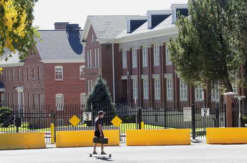 Al Hartmann  |  The Salt Lake Tribune
A University of Utah student rides his skateboard along Hempstead Road on today's much smaller version of Fort Douglas.