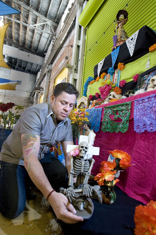 Paul Fraughton | The Salt Lake Tribune
Jorge Fierro works on a Day of the Dead shrine October 31, 2012 in the Rico Brand kitchens and warehouse where the specialty food company will host a Day of the Dead celebration Friday, November 2, to raise money for the Utah Food Bank.