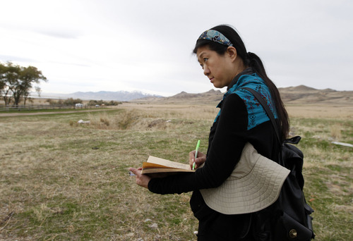 Al Hartmann  |  The Salt Lake Tribune
Cao Xiang Bin, a member of a Chinese artist group does a pen and ink sketch at the Garr Ranch at the south end of Antelope Island Thursday Novmeber 1.  The group of  artists spent the day photographing and sketching.   The Division of Utah State Parks on behalf of Antelope Island is signing a sister/marketing relationship with the Jinshanling section of the Great Wall in China.