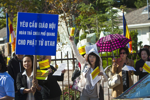 Chris Detrick  |  The Salt Lake Tribune
Members of the local Buddhist congregation of Pho Quang Temple protest outside the Temple Lien Hoa Buddhist on Saturday, Oct. 6, 2012. They hoped to highlight their conflict to the monks, who belong to the California-based Vietnamese-American Unified Buddhist Congress, which is seeking to take control of Pho Quang.