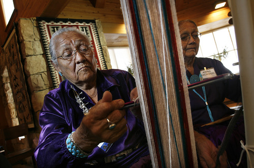 Scott Sommerdorf  |  The Salt Lake Tribune              
Frances Bahe weaves a belt as Salt Lake and Park City school kids watch as part of the Adopt A Native Elder Program at the Deer Valley Resort, Snow Park Lodge, on Thursday. The children visited with American Indian elders and learned weaving skills, history and songs.