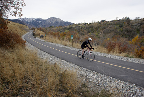 Rick Egan  | The Salt Lake Tribune 
A cyclist rides along Parleys Trail on Thursday. Some of the proceeds from a $47 million parks and trails bond that will be on the Nov. 6 ballot in Salt Lake County will be used to connect existing segments of the trail.