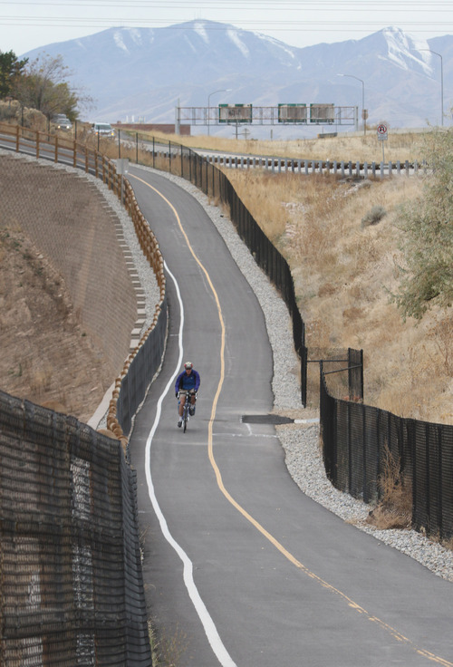 Rick Egan  | The Salt Lake Tribune 
A cyclist rides Parleys Trail, Thursday. Some of the proceeds from a $47 million parks and trails bond that will be on the Nov. 6 ballot in Salt Lake County will be used to connect existing segments of the trail.