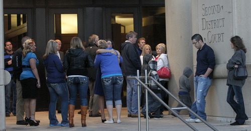 Al Hartmann  |  The Salt Lake Tribune
Friends and family members gather on the steps of the 2nd District Court in Ogden Friday November 2  to show their support for law enforcement  officers wounded and killed during the January 4 shootout with Matthew David Stewart, whose preliminary hearing is winding up Friday.   Erin Francom, wife of slain officer Jared Francom, center, gets a hug from a friend.