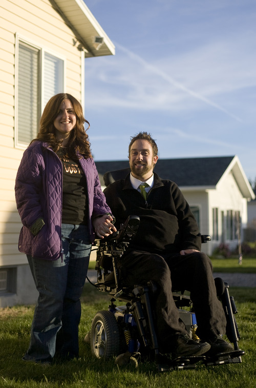 Kim Raff  |  The Salt Lake Tribune
Newlyweds Rich and Amy McKenzie outside their home in Plain City, Utah ,on October 28, 2012. Rich McKenzie was with his four friends on a trip at the San Rafael Swell in celebration of their high school graduation when he dove into a river with a hidden sandbar just below the surface. He became instantly paralyzed. Fourteen years later, the five have stayed friends, all getting married and starting families except for Rich -- until now. He met Amy Terry last year and they were married last month.