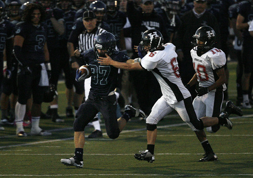 Scott Sommerdorf  |  The Salt Lake Tribune              
Juan Diego RB Chase Williams, #37, breaks off a big gain around right end during second half play. Zach Prince defends fo Hurricane. Juan Diego beat Hurricane 38-0 in a 3A state quarterfinal playoff game, Friday, November 2, 2012.