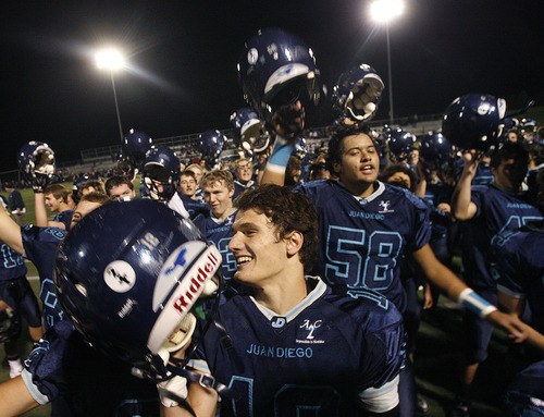 Scott Sommerdorf  |  The Salt Lake Tribune              
Juan Diego QB Nick Markosian, #12, sings the school song with team mates after the game was over. Markosian was one of the Soaring Eagles' offensive stars. Juan Diego beat Hurricane 38-0 in a 3A state quarterfinal playoff game, Friday, November 2, 2012.
