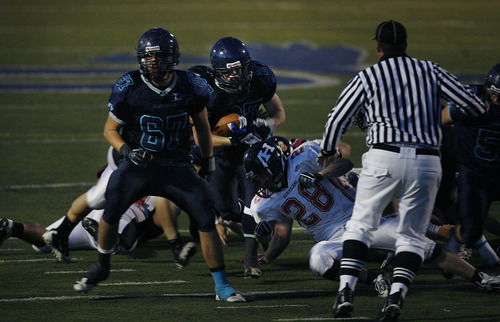 Scott Sommerdorf  |  The Salt Lake Tribune              
Juan Diego RB Jessie Springer, #27, plows into the Hurrican line during second half play. Juan Diego beat Hurricane 38-0 in a 3A state quarterfinal playoff game, Friday, November 2, 2012.