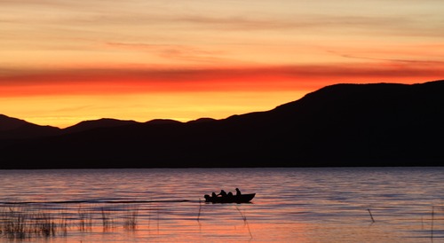 Rick Egan  | The Salt Lake Tribune 
A boat makes its way to shore as the sunsets at Utah Lake State Park, Sunday evening, November 4, 2012.