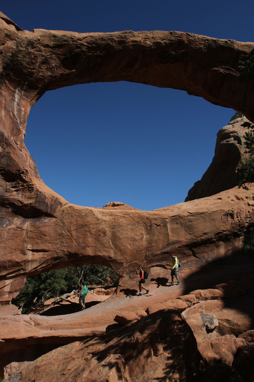 Francisco Kjolseth  |  The Salt Lake Tribune
Visitors check out Double O Arch which can be accessed from the Devils Garden Trailhead located at the end of the road in Arches National Park.