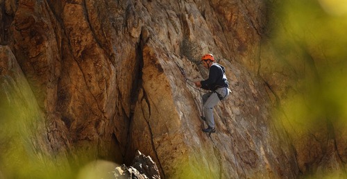 Leah Hogsten  |  The Salt Lake Tribune
Dale Sperry readies his climbing ropes to rappel off the Dynamite Crack while climbing on his lunch hour with a co-worker in Rock Canyon, Wednesday, October 17, 2012.
