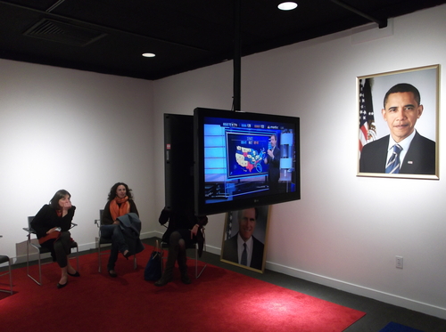 Election watchers Tuesday pick up the results on Fox News and MSNBC at the Utah Museum of Contemporary Art, at an exhibit where both networks were screening in a room split red and blue. The exhibit, by artist Jonathan Horowitz, is called "Your Land/My Land: Election '12." (photo by Sean P. Means  |  The Salt Lake Tribune)