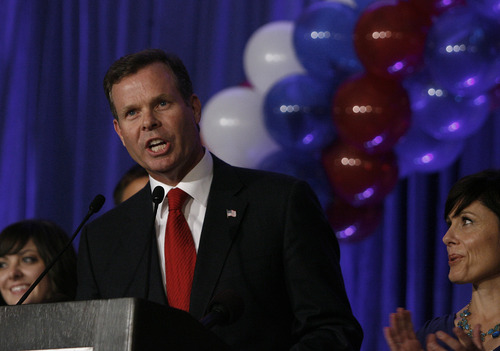 Scott Sommerdorf  |  The Salt Lake Tribune              
Utah Attorney General candidate John Swallow speaks at the GOP headquarters with his wife Suzanne at right, Tuesday, November 6, 2012