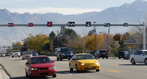 Al Hartmann  |  The Salt Lake Tribune
View looking east on 5400 South at 3200 West on Monday shows the "flex lane" lights that have been turned on for several days so motorists can get used to them. Beginning Wednesday, the system will go active so that lanes will change direction during the day in the attempt to alleviate rush-hour congestion.