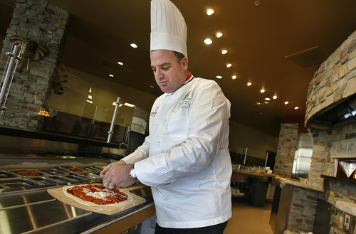 Scott Sommerdorf  |  The Salt Lake Tribune              
Kent Andersen makes a pizza at his new restaurant Malawi's Pizza, one of two restaurants opening this week at The Gateway in Salt Lake City. Andersen's La Jolla Groves also is opening at the mall.