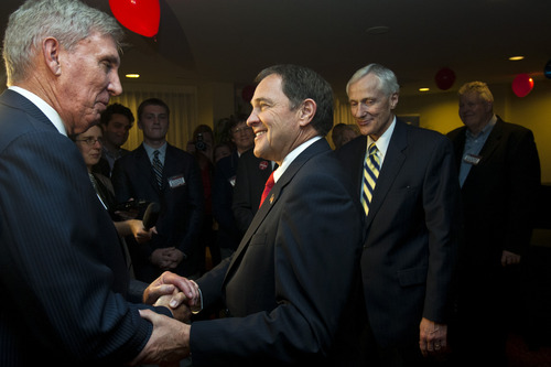 Gubernatorial candidate Peter Cooke, left, congratulates Utah Gov. Gary Herbert as Lt. Governor Greg Bell, right looks on during the Republican Election Night Party at the Salt Lake Hilton Hotel Wednesday,Nov.  7, 2012,  in Salt lake City. Herbert has won his race against Cooke. (AP Photo/The Salt Lake Tribune, Chris Detrick) LOCAL TV OUT; MAGS OUT; DESERET NEWS OUT *