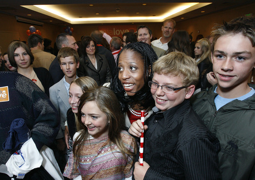 Scott Sommerdorf  |  The Salt Lake Tribune              
4th Congressional candidate Mia Love poses for photos with supporters at the GOP headquarters at the Hilton Hotel in Salt Lake City, Tuesday, November 6, 2012.