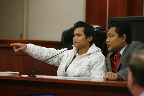 Francisco Kjolseth  |  The Salt Lake Tribune
Maung Mye, 26, left, sitting next to interpreter Eh Taw Dwe , identifies Esar Met, charged with killing 7-year-old Hser Ner Moo in 2008, during the start of the seven-day preliminary hearings at Matheson Courthouse in Salt Lake City on Wednesday, November 7, 2012, before Judge William Barrett.