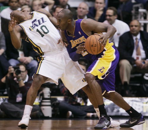 Kim Raff | The Salt Lake Tribune
(left) Utah Jazz point guard Alec Burks (10) reacts to getting a shoulder in the face by (right) Los Angeles Lakers shooting guard Kobe Bryant (24) during a game at EnergySolutions Arena in Salt Lake City, Utah on November 7, 2012.