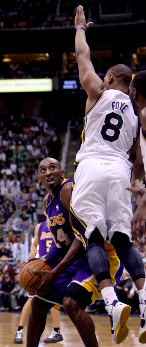 Kim Raff | The Salt Lake Tribune
(left) Los Angeles Lakers shooting guard Kobe Bryant (24) looks to for an opening as Utah Jazz point guard Randy Foye (8) defends during a game at EnergySolutions Arena in Salt Lake City, Utah on November 7, 2012. Jazz went on to win the game 95-86.