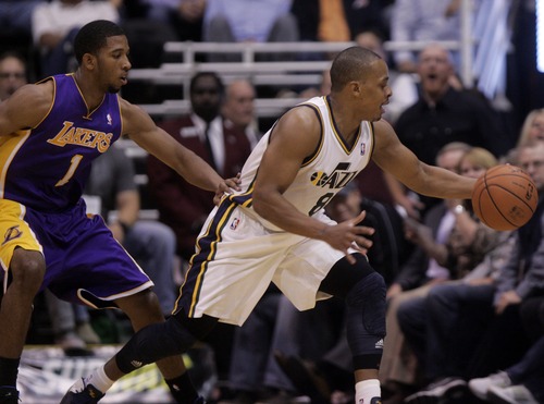 Kim Raff | The Salt Lake Tribune
(right) Utah Jazz point guard Randy Foye (8) tries to keep possession of the ball from (left) Los Angeles Lakers point guard Darius Morris (1) during a game at EnergySolutions Arena in Salt Lake City, Utah on November 7, 2012.