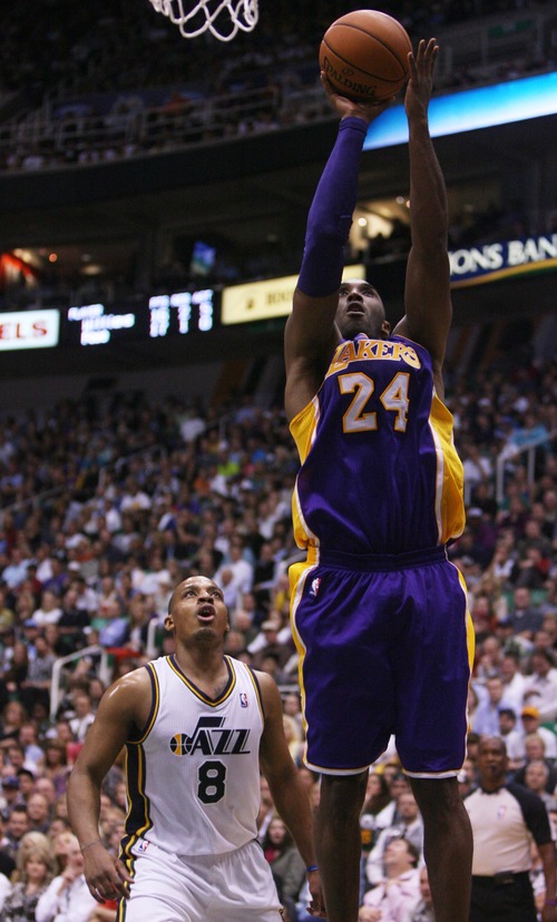 Kim Raff | The Salt Lake Tribune
Los Angeles Lakers shooting guard Kobe Bryant (24) scores two points on a layup as (left) Utah Jazz point guard Randy Foye (8) looks on during a game at EnergySolutions Arena in Salt Lake City, Utah on November 7, 2012. Jazz went on to win the game 95-86.