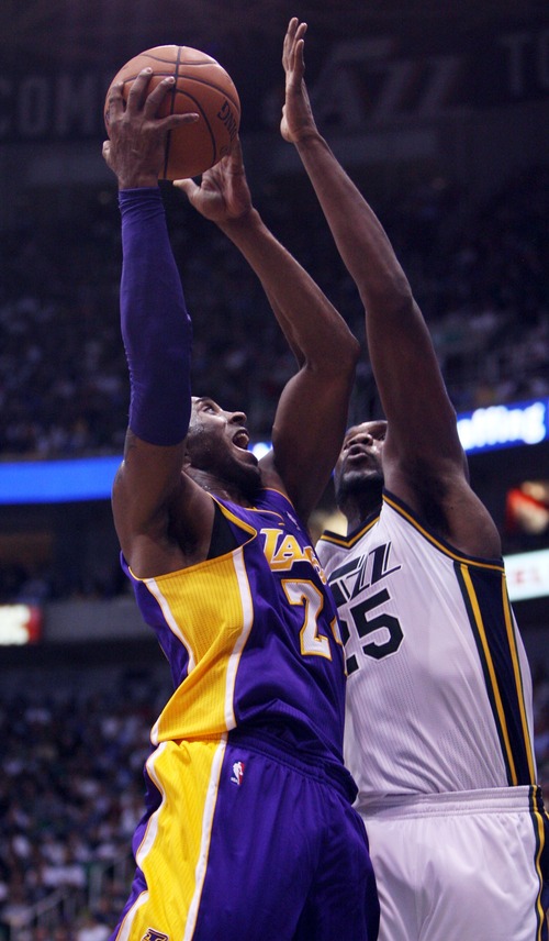 Kim Raff | The Salt Lake Tribune
Los Angeles Lakers shooting guard Kobe Bryant (24) takes a shot as Utah Jazz center Al Jefferson (25) defends during a game at EnergySolutions Arena in Salt Lake City, Utah on November 7, 2012. Jazz went on to win the game 95-86.