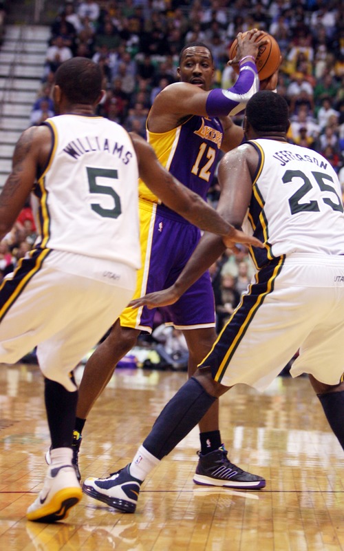 Kim Raff | The Salt Lake Tribune
(middle) Los Angeles Lakers center Dwight Howard (12) looks to pass the ball past (left) Utah Jazz point guard Mo Williams (5) and Utah Jazz center Al Jefferson (25) during a game at EnergySolutions Arena in Salt Lake City, Utah on November 7, 2012. Jazz went on to win the game 95-86.