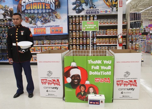 Rick Egan  | The Salt Lake Tribune 
U.S. Marine Lance Cpl. Marc Sumampong stands ready to assists shoppers interested in donating to Toys for Tots at the Murray Toys R Us store. Local Marine units will be helped kick off the annual holiday toy drive to benefit the Marine Toys for Tots Foundation.